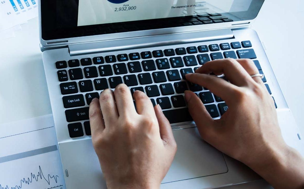 Person typing on a laptop
